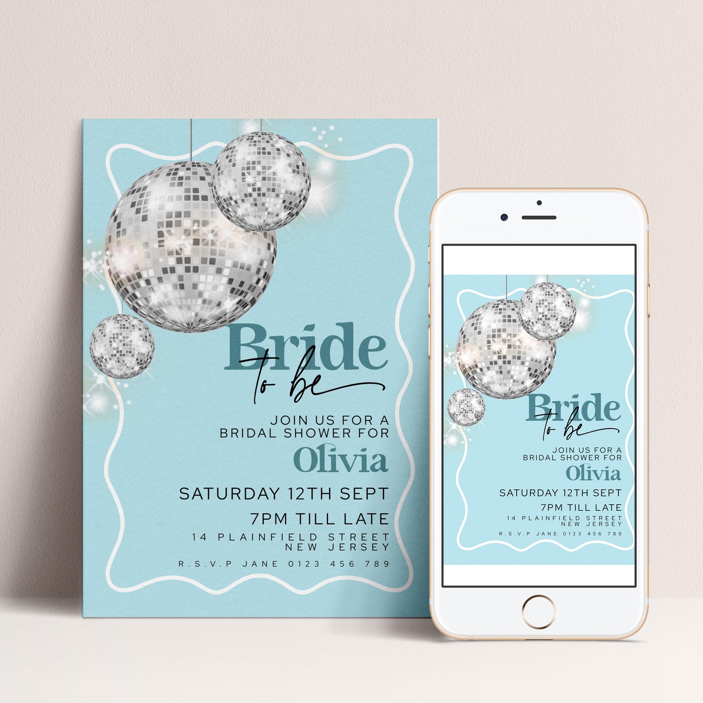 The image is a wedding invitation featuring a light blue background with a white border, and it includes a disco ball design.