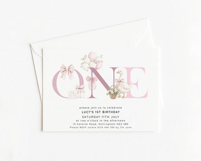 The image is a birthday invitation for a girl named Lucy, celebrating her first birthday.