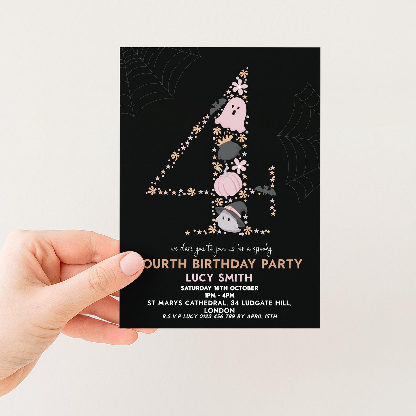 A hand holding a birthday party invitation card with a black background and a spooky design featuring a number 4 and ghost-like figures.