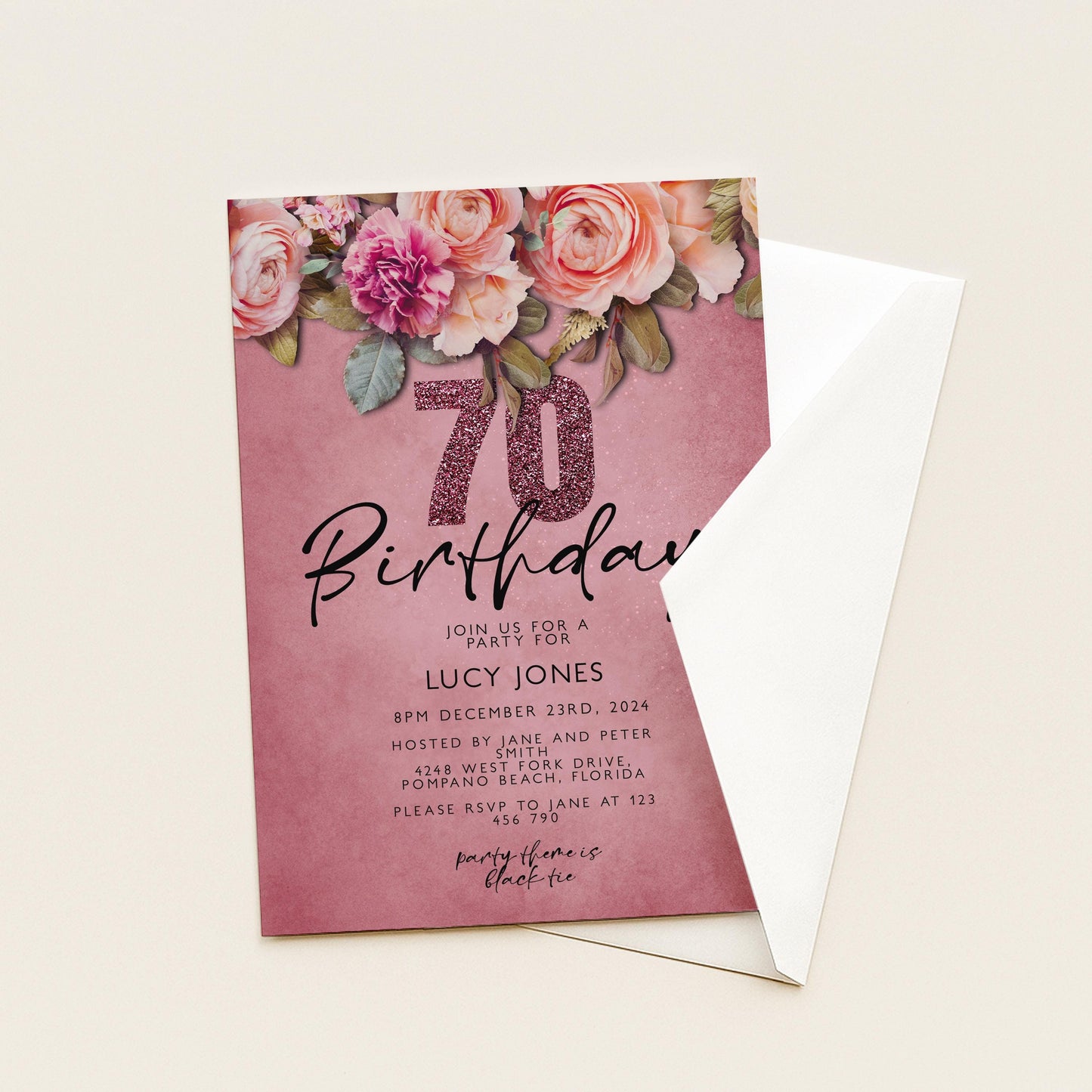 A pink birthday invitation card with a floral design and the number 70.