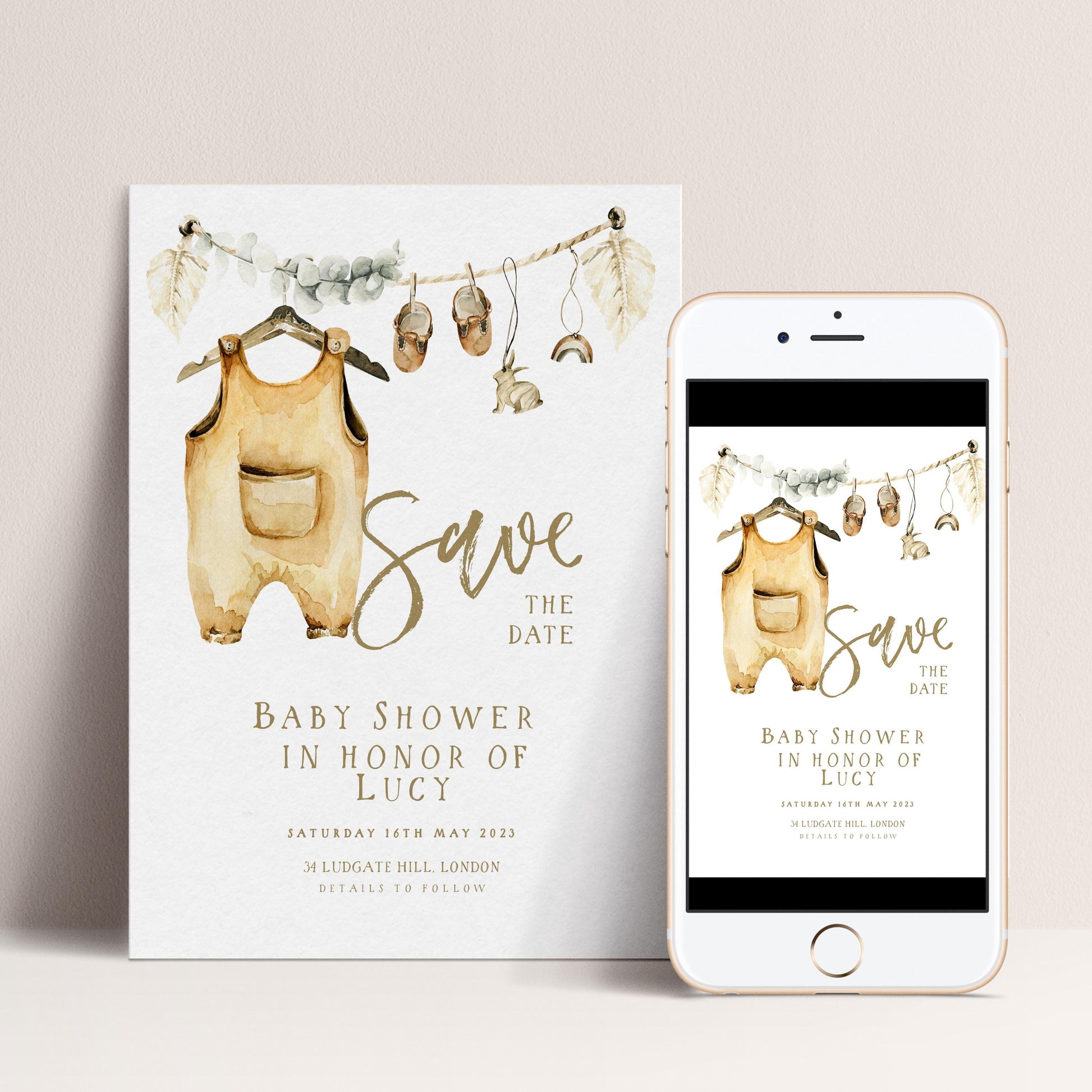 a white card and a smartphone with a baby shower invitation. The card features a baby's onesie and a baby shower banner, while the smartphone displays the same invitation.