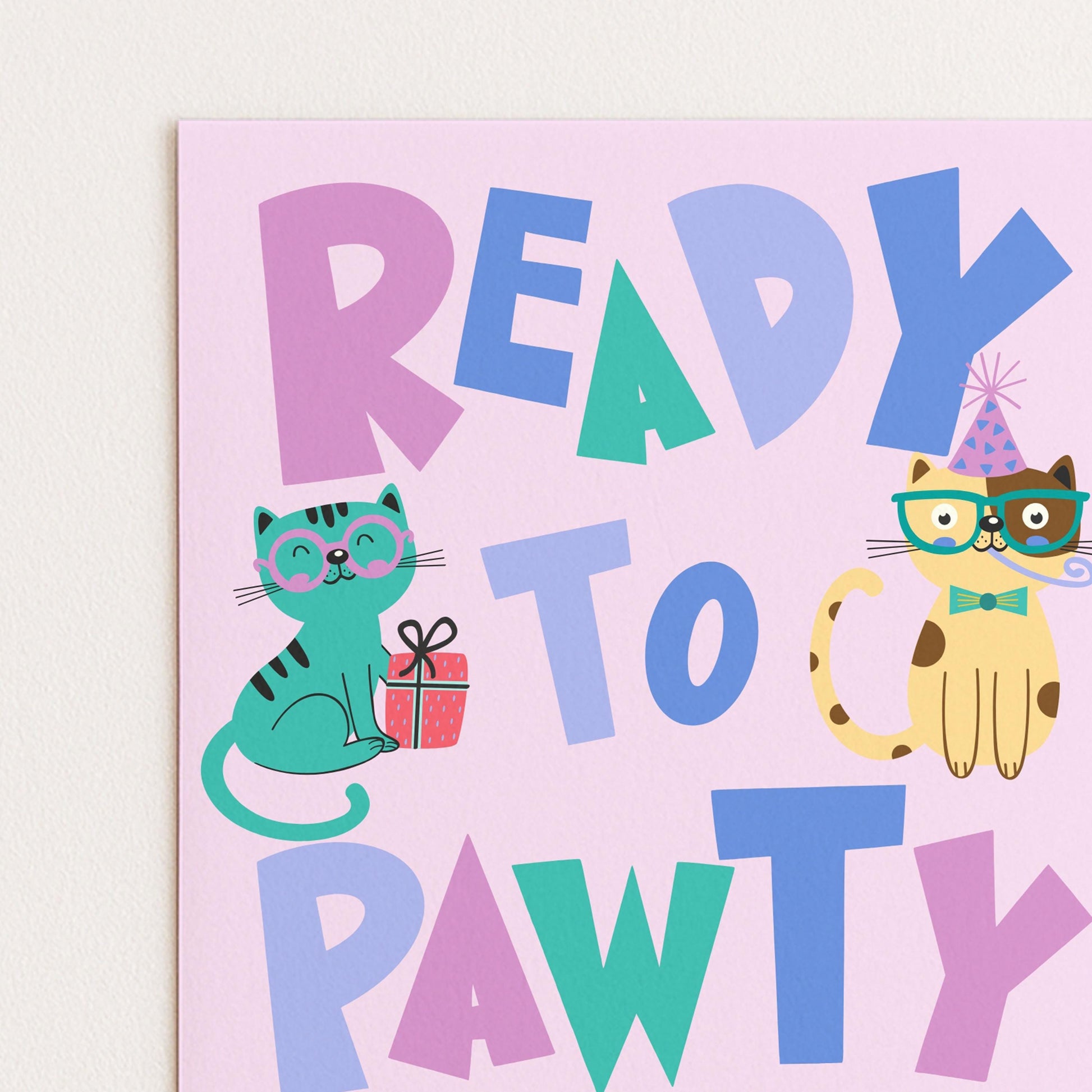 The image is a colorful birthday card with the phrase "READY TO PAWTY" written on it. The card features illustrations of two cats, one wearing a party hat and the other holding a gift.
