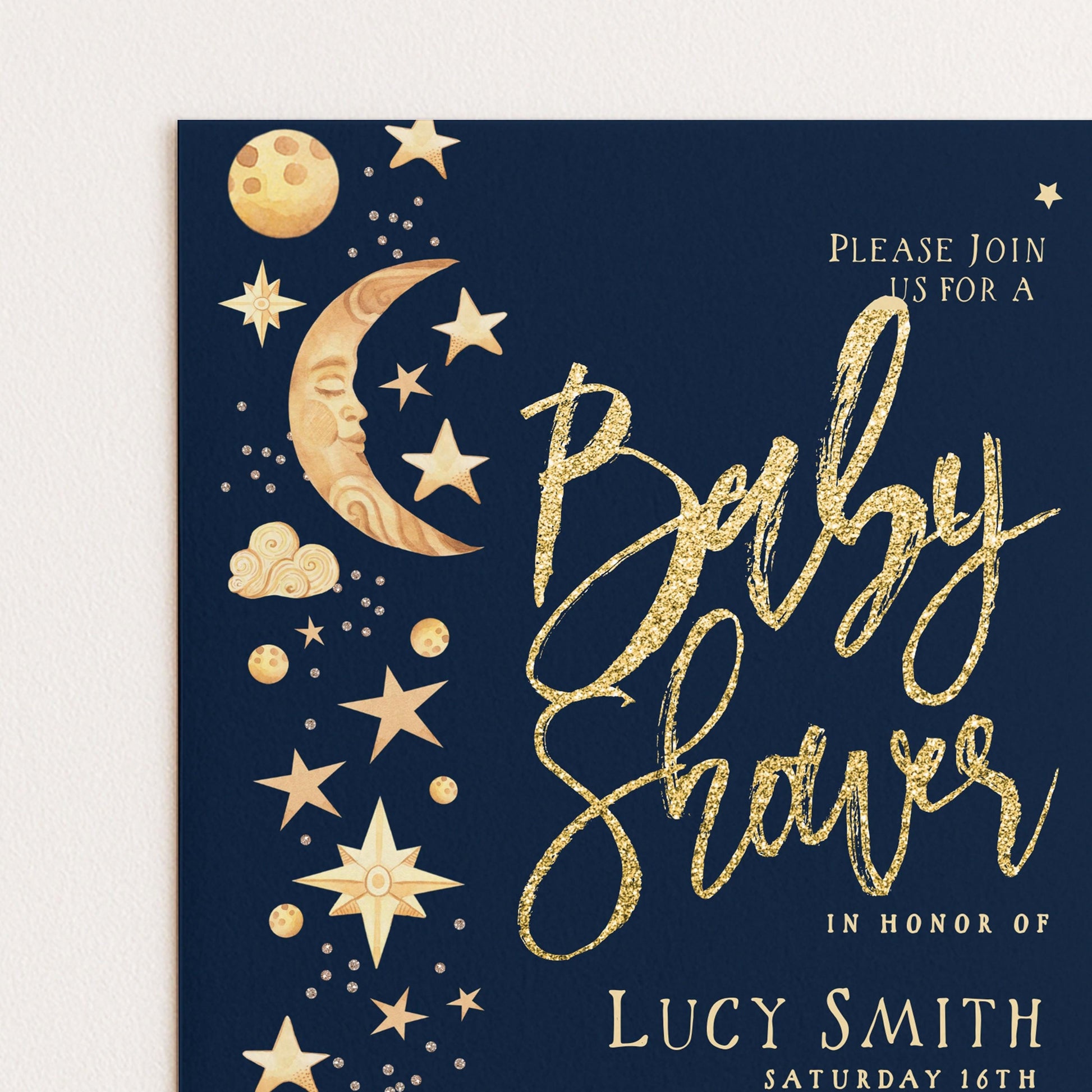 The image is a baby shower invitation with a dark blue background and gold text and illustrations.