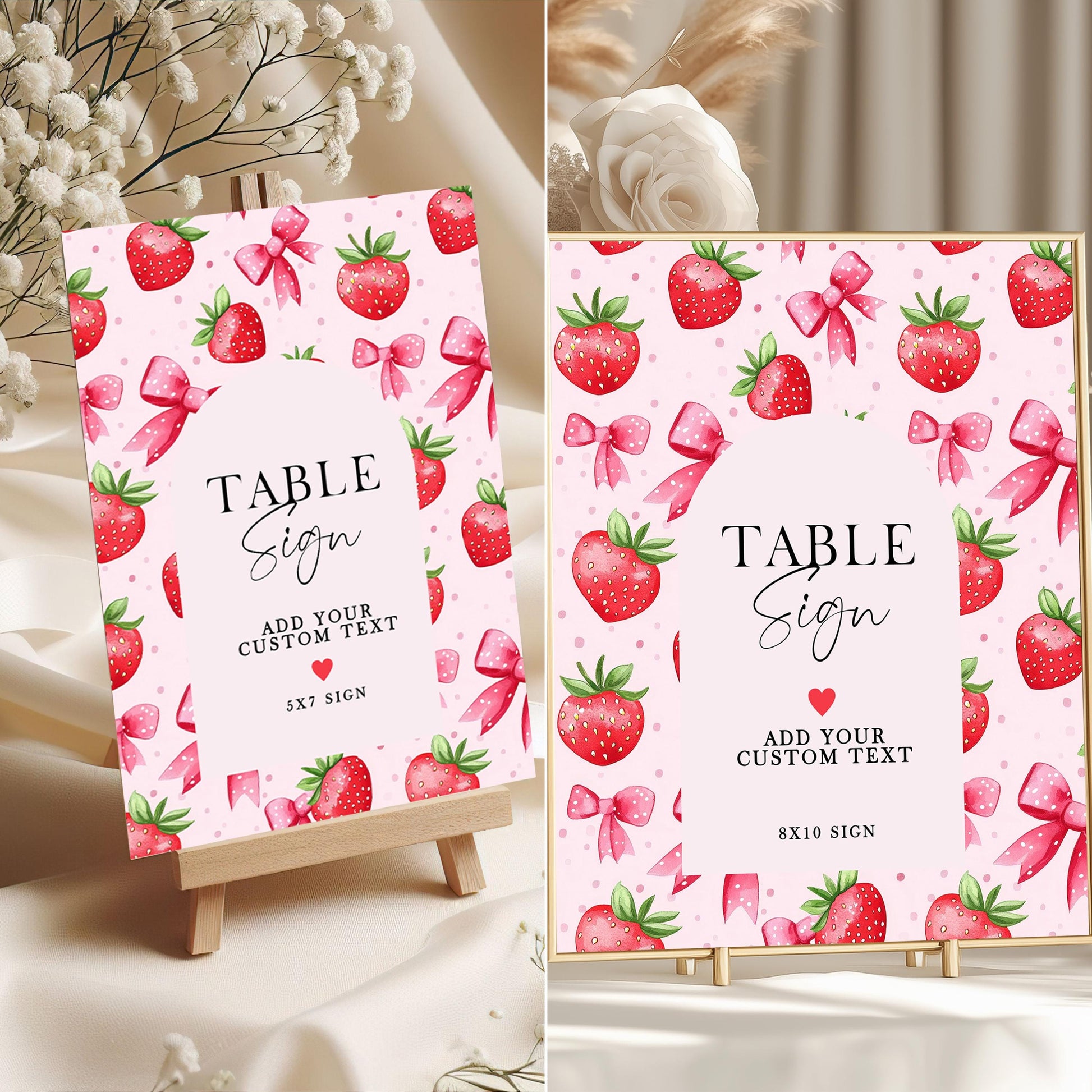 Editable strawberry-themed table signs in 5x7 and 8x10 sizes with pink background, red strawberries, and bows, displayed on mini easels for birthday party decor.