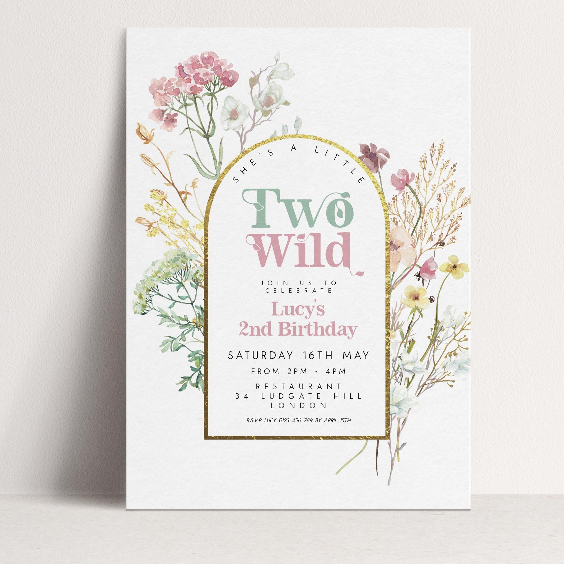 A birthday invitation for Lucy's 2nd birthday, featuring a floral design with pink and white flowers and greenery.