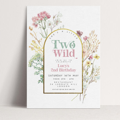 A birthday invitation for Lucy's 2nd birthday, featuring a floral design with pink and white flowers and greenery.