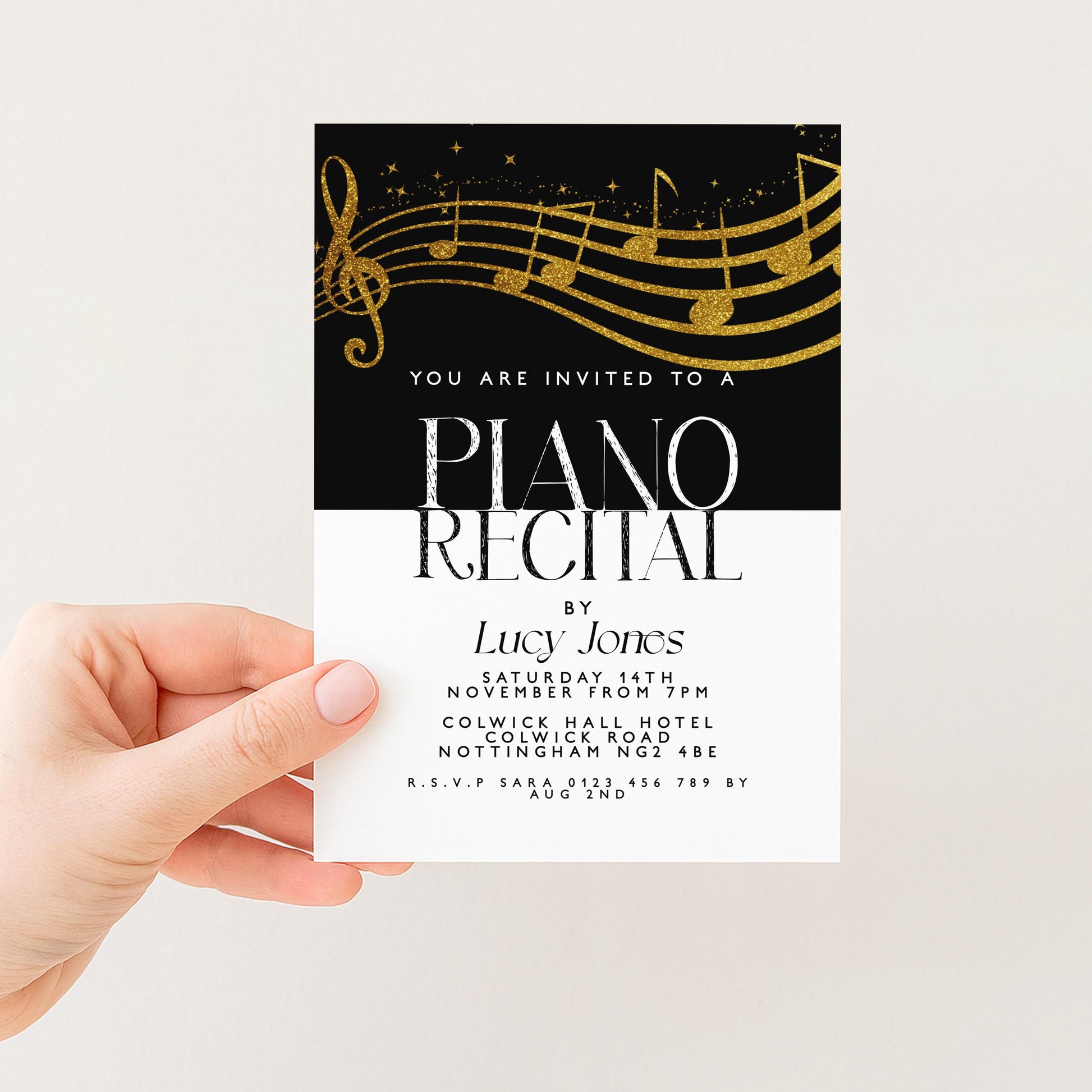 The image is a hand holding a printed invitation card for a piano recital.
