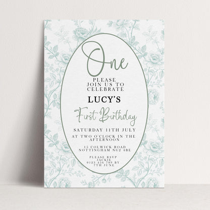 The image is a birthday invitation for a girl named Lucy's first birthday.