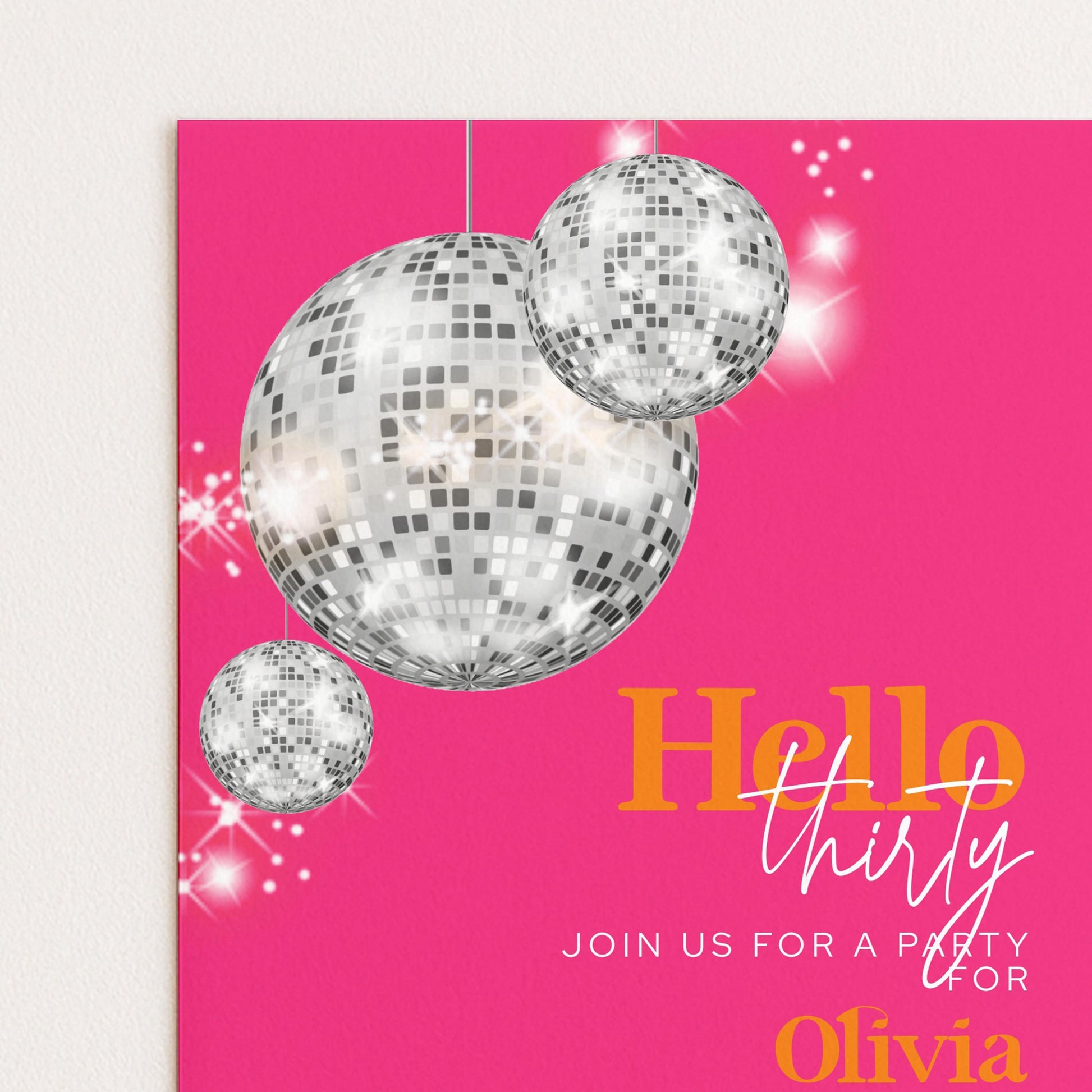 The image is a vibrant pink invitation card with a disco ball design and the text "Hello Thirty" prominently displayed.