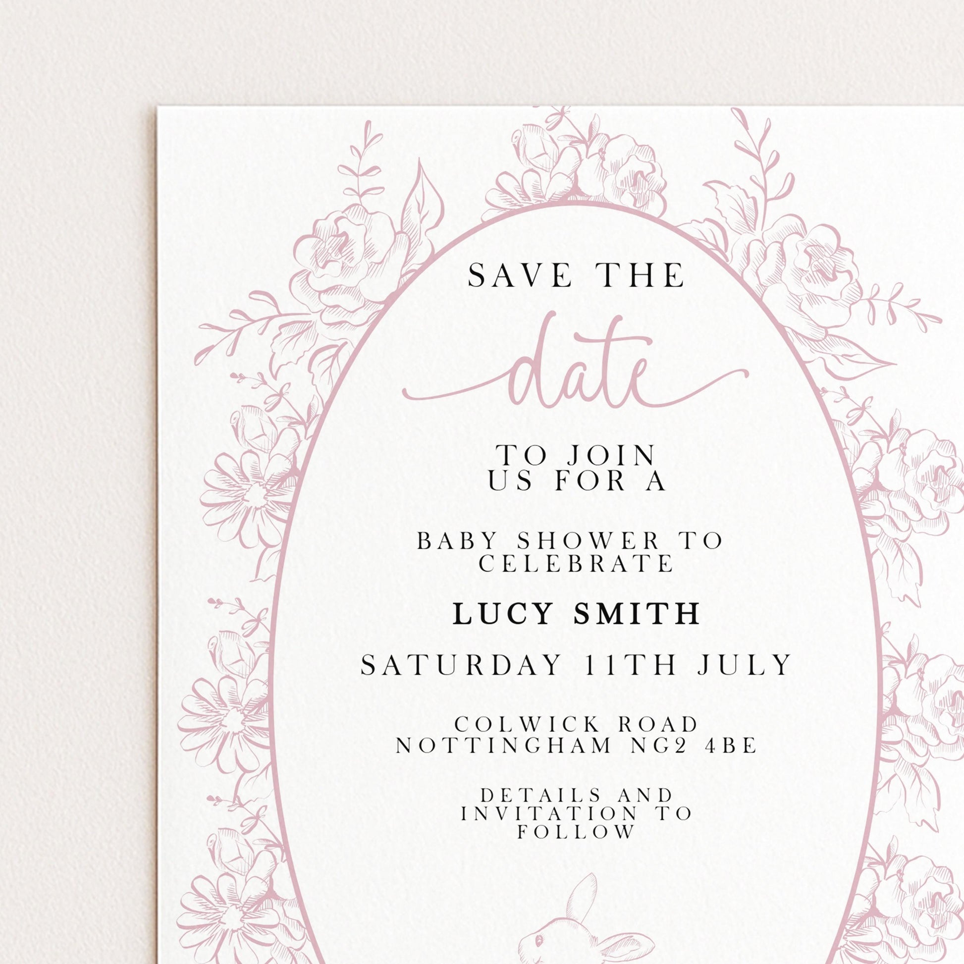 The image is a pink and white invitation card for a baby shower, featuring a floral border and text inviting guests to join for a baby shower to celebrate Lucy Smith's birthday.