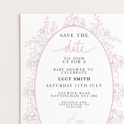 The image is a pink and white invitation card for a baby shower, featuring a floral border and text inviting guests to join for a baby shower to celebrate Lucy Smith's birthday.