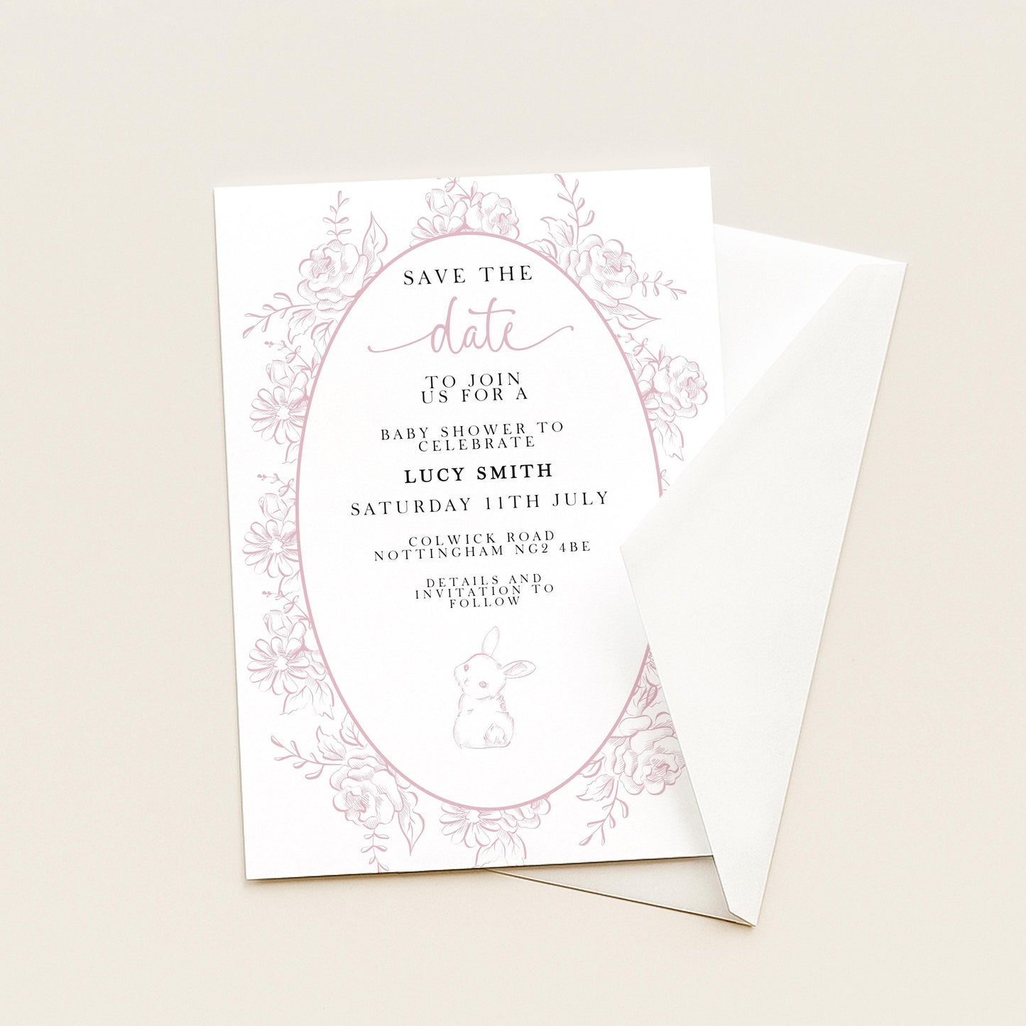 The image is a white invitation card with pink floral designs and text, inviting guests to a baby shower for Lucy Smith.