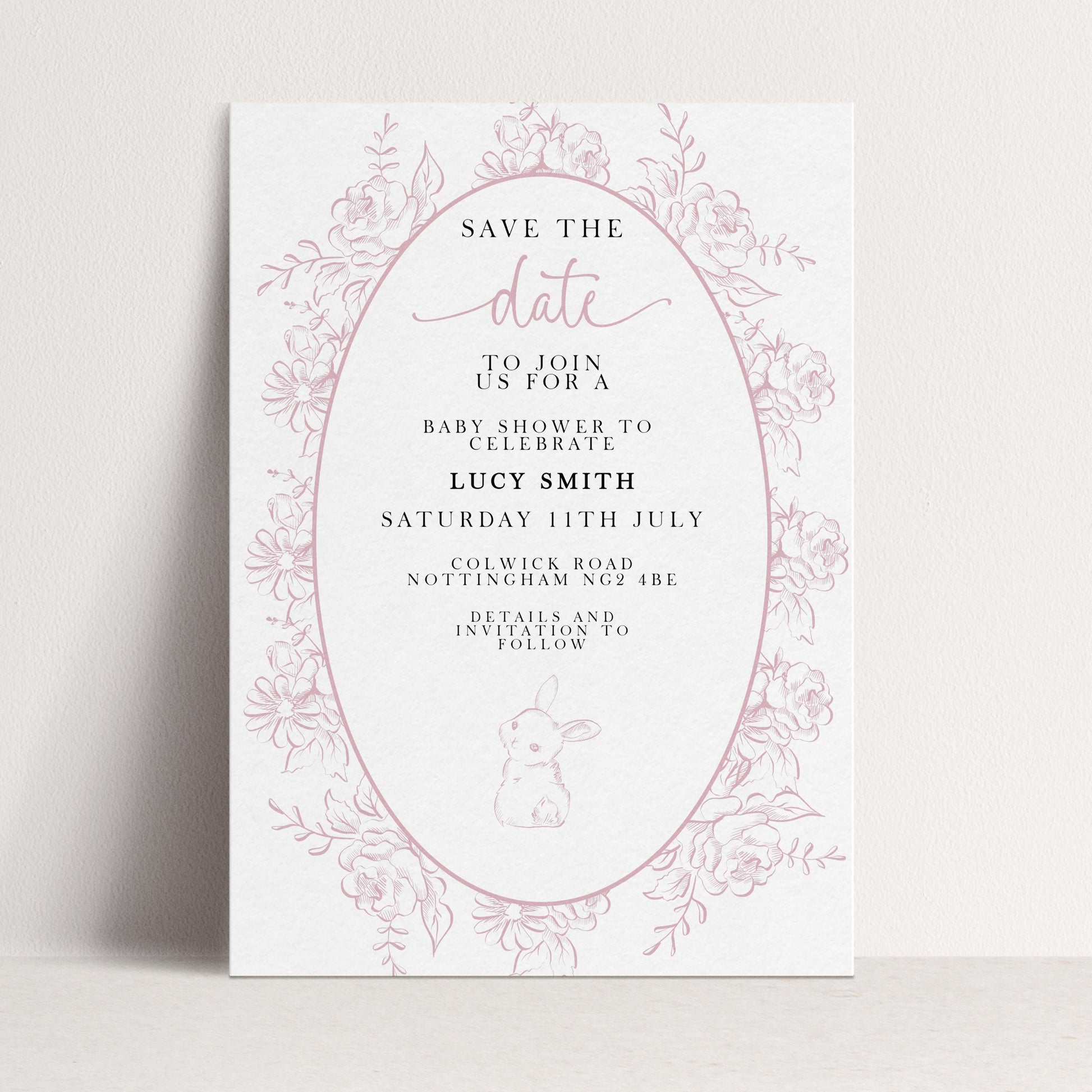The image is a pink and white invitation card for a baby shower, featuring a floral border and text inviting guests to join for a baby shower to celebrate Lucy Smith.