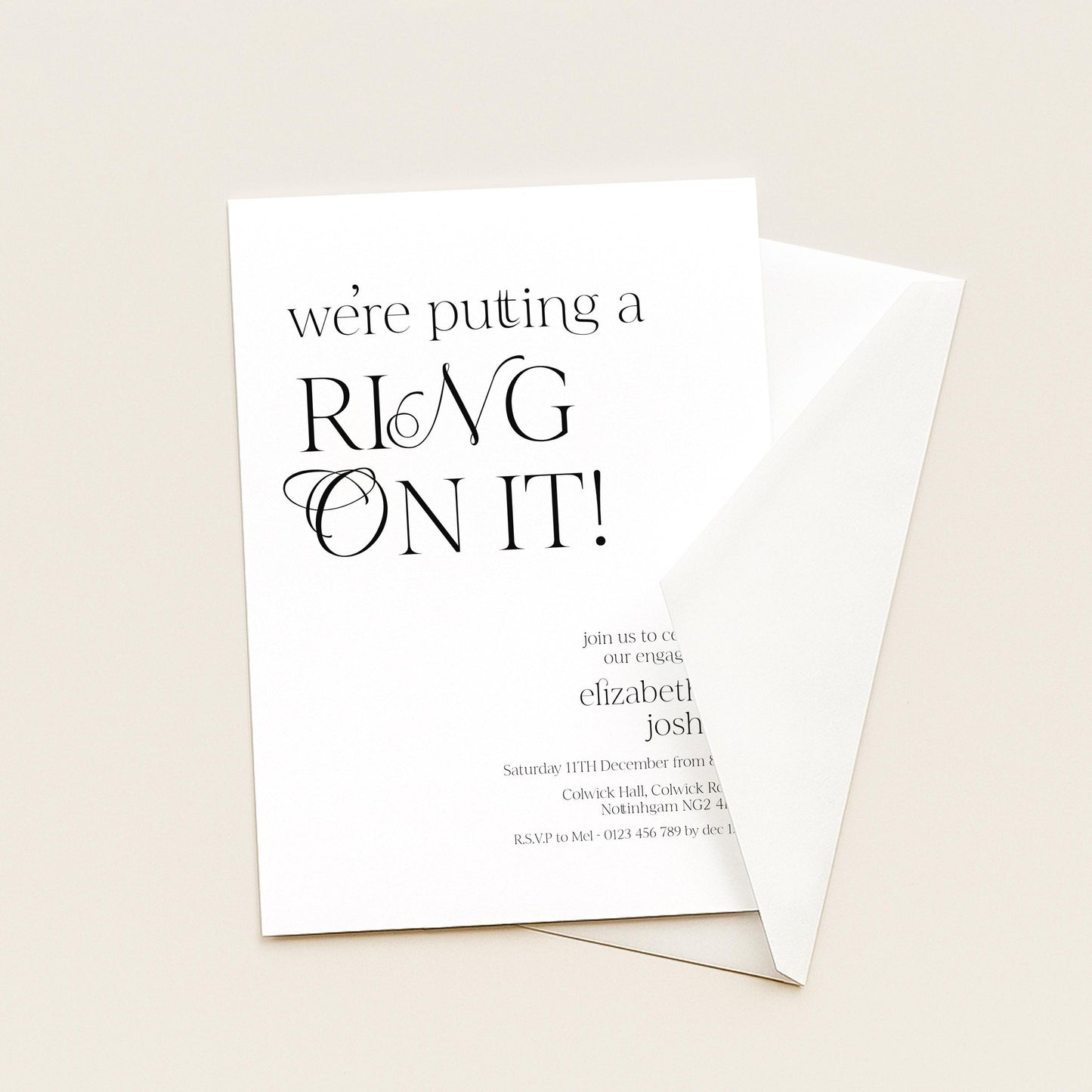 The image is a wedding invitation card with the text "we're putting a ring on it!" The card is white and has a black font.