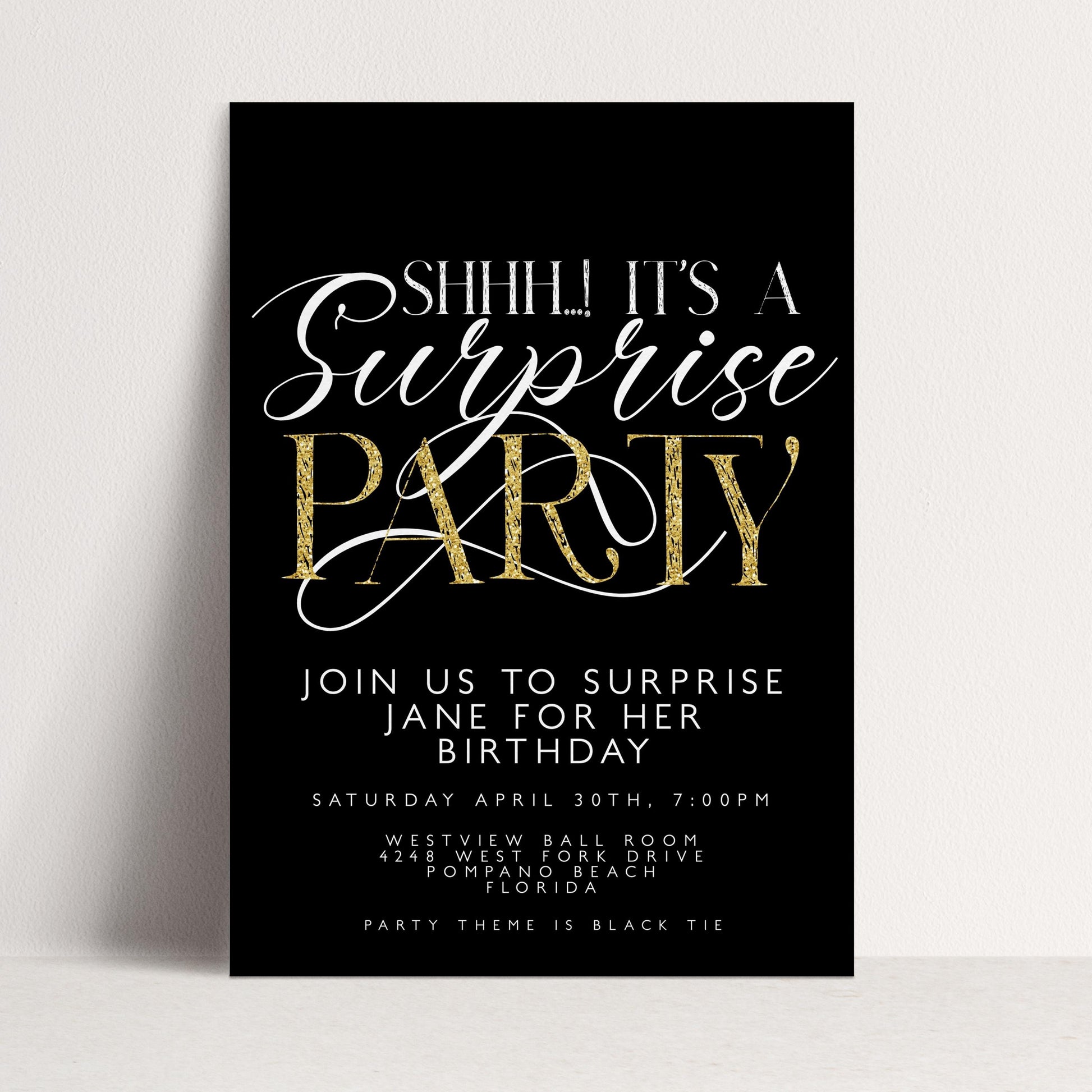 The image is a black and white invitation card for a surprise party.