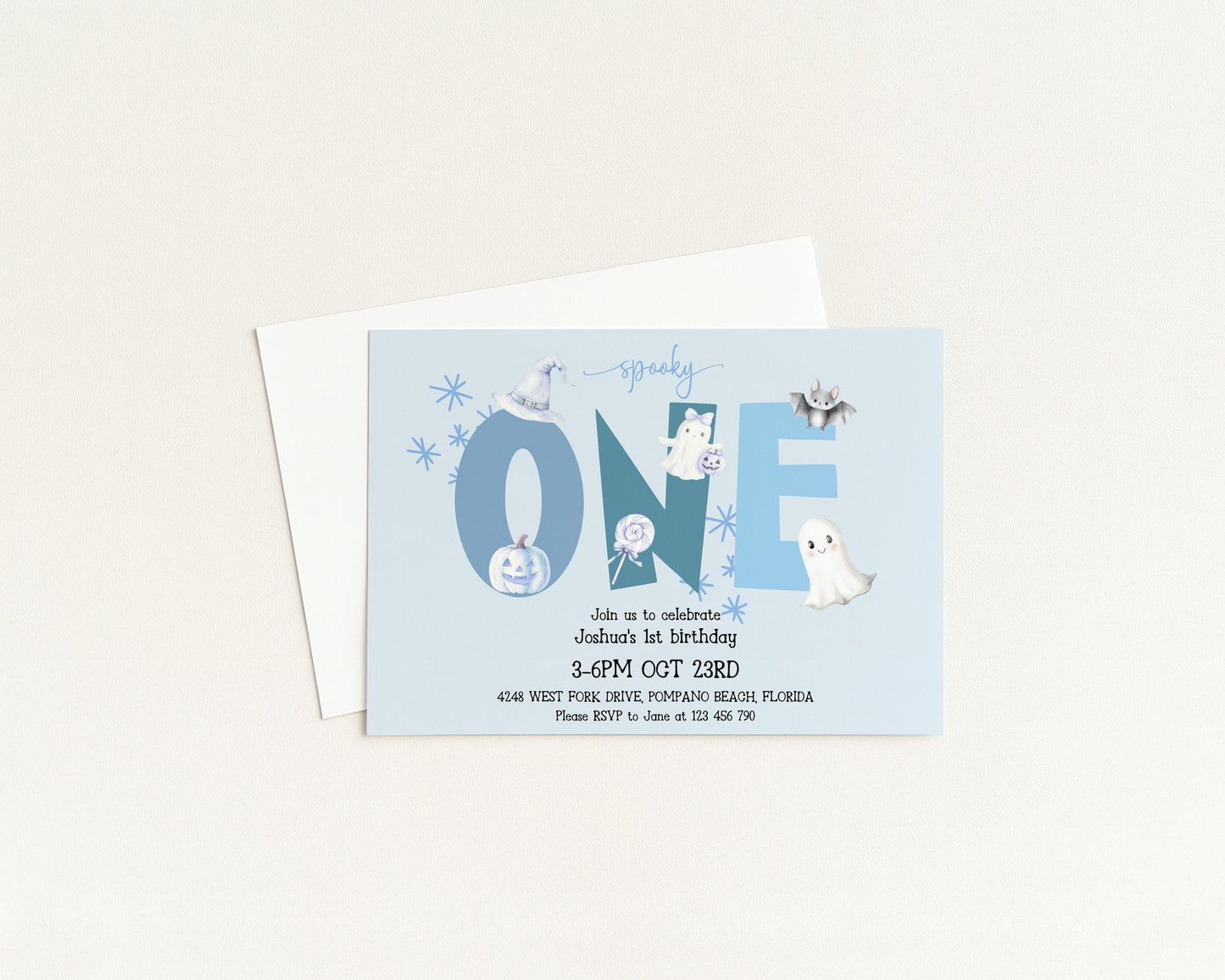The image is a birthday invitation for a one-year-old, featuring a spooky theme with various Halloween-themed elements such as bats, pumpkins, and ghostly figures.