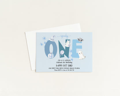 The image is a birthday invitation for a one-year-old, featuring a spooky theme with various Halloween-themed elements such as bats, pumpkins, and ghostly figures.
