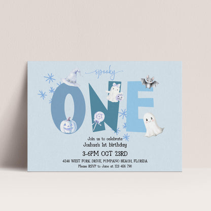 The image is a birthday invitation for a one-year-old named Joshua, celebrating his first birthday. The invitation features a Halloween theme with various spooky and ghostly elements, including a bat, ghost, and pumpkin. The event is scheduled to take place on October 23rd at 4:48 PM at the West Fork Drive, Pompano Beach, Florida. Guests are encouraged to RSVP to June at 125 446-790.