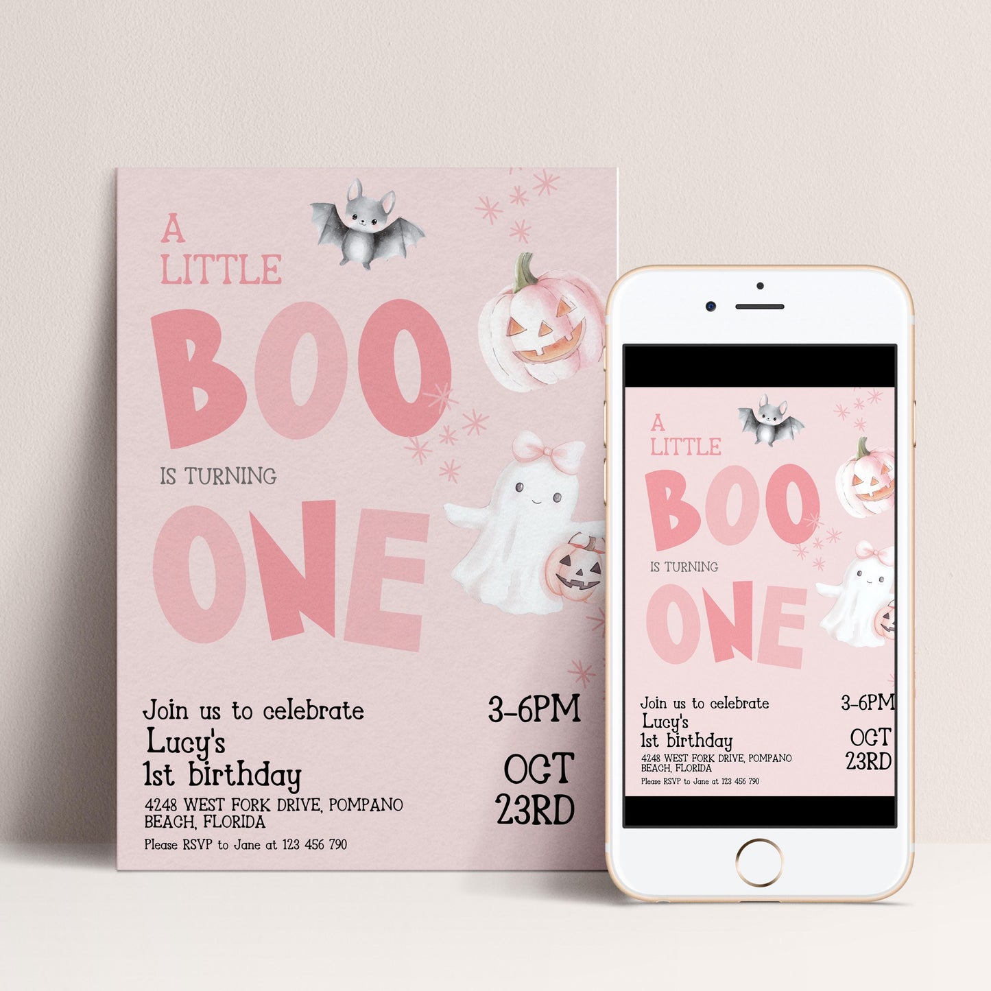 The image is a birthday invitation for a little girl named Lucy, celebrating her 1st birthday. The invitation features a pink background with illustrations of bats, pumpkins, and a ghost. The text invites guests to join the celebration and provides details about the event, including the date, time, location, and RSVP instructions.