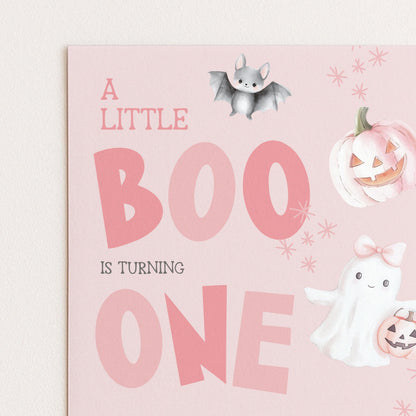 A birthday card with a pink background and illustrations of a bat, pumpkin, and ghost.