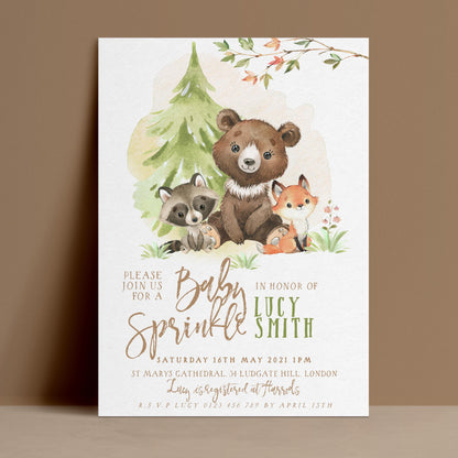 Editable baby sprinkle invitation with watercolour woodland bear raccoon and fox beside pine tree on soft background — digital download template via Corjl