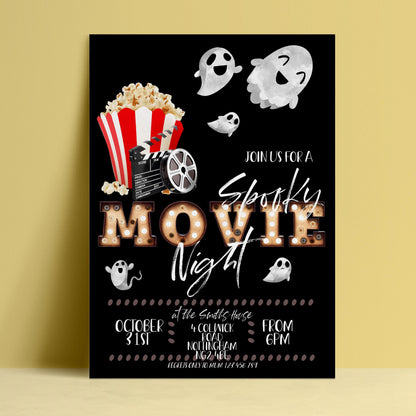 Editable Halloween movie night invitation with vintage marquee letters ghosts and popcorn on black background — digital download template via Corjl