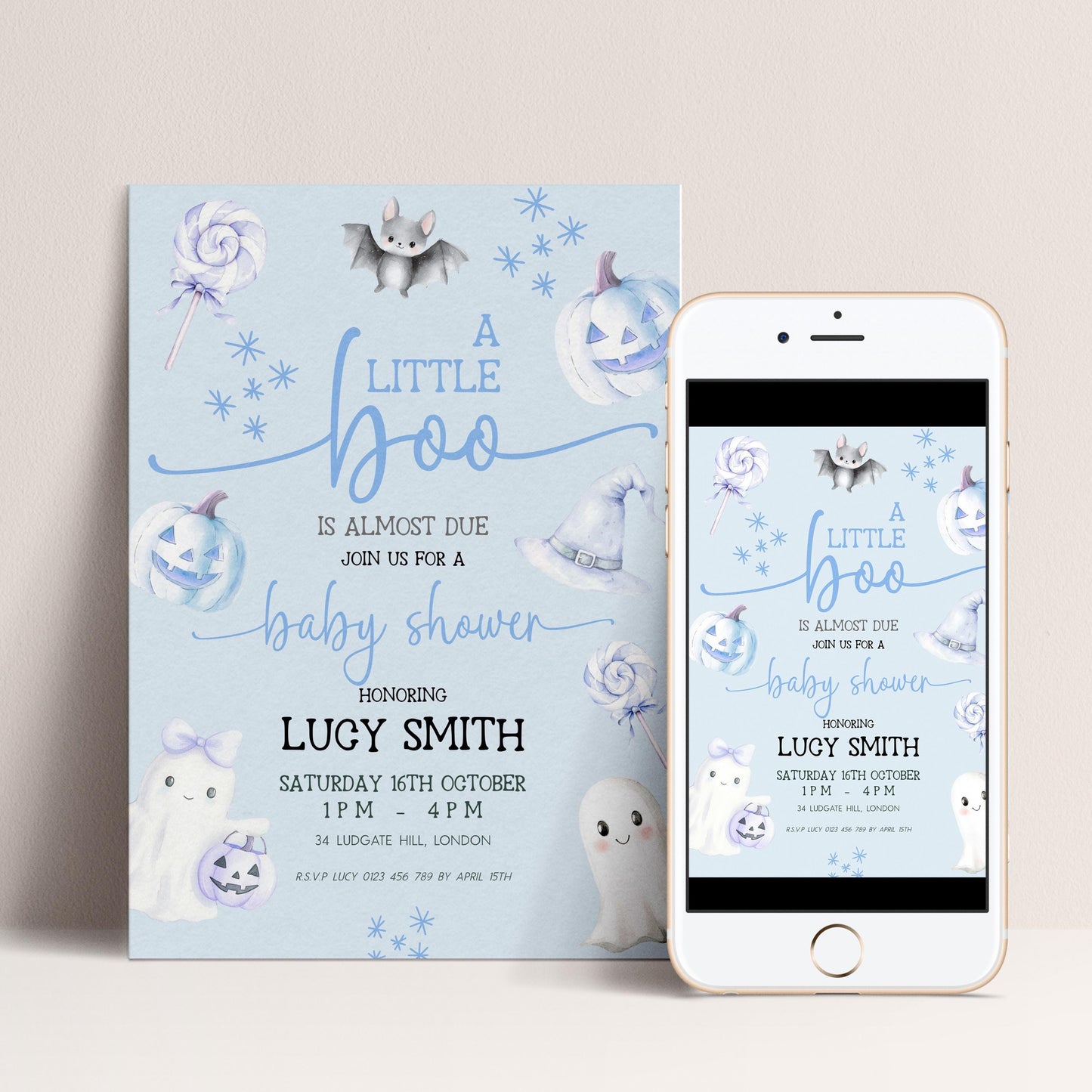A baby shower invitation featuring a blue and white color scheme with Halloween-themed decorations, including bats, pumpkins, and ghostly figures.