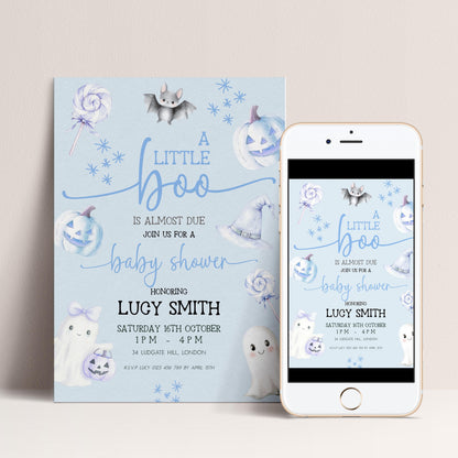 A baby shower invitation featuring a blue and white color scheme with Halloween-themed decorations, including bats, pumpkins, and ghostly figures.