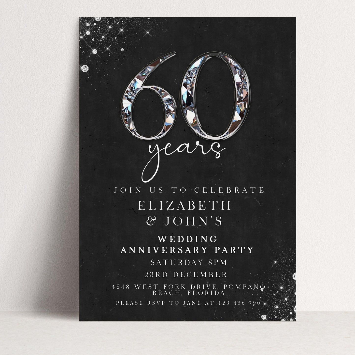 The image is a black and white invitation card for a wedding anniversary party. It features the number 60 and details the event, including the date, time, location, and RSVP instructions.