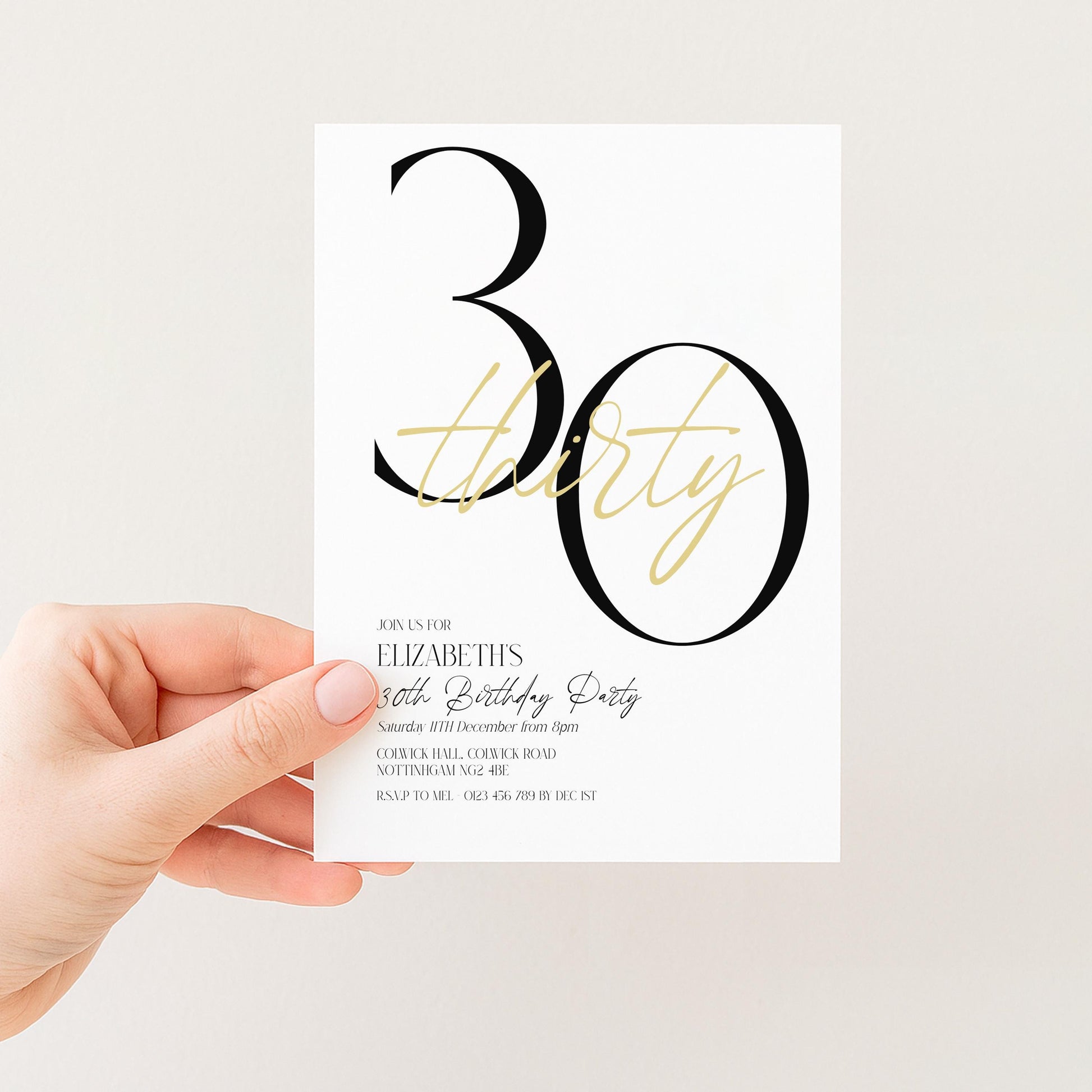 A person's hand holding a white invitation card with black text and design.