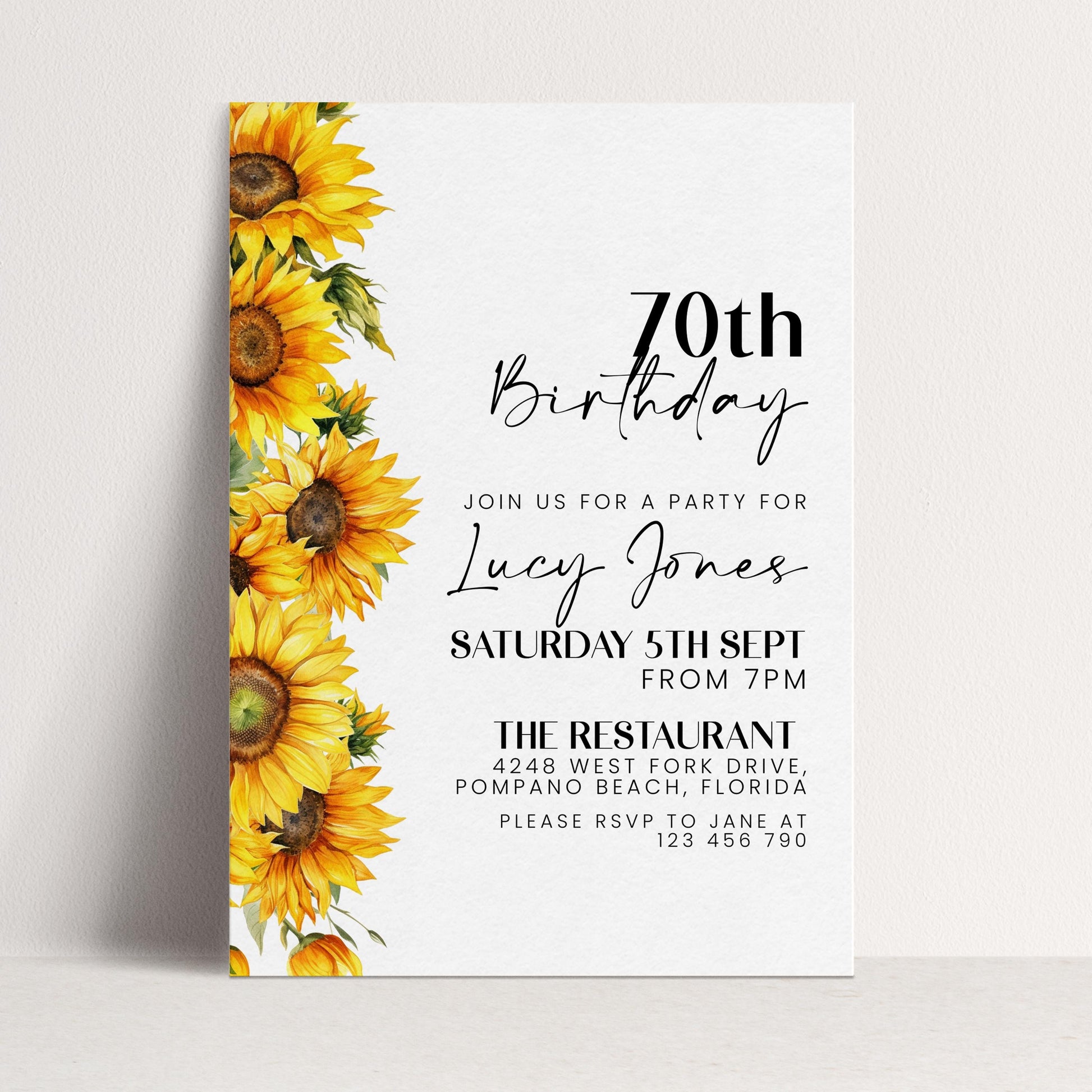 The image is a birthday invitation for a 70th birthday party for Lucy Jones. The invitation features a vibrant yellow sunflower design on the left side and includes details about the party, including the date, time, location, and RSVP instructions.