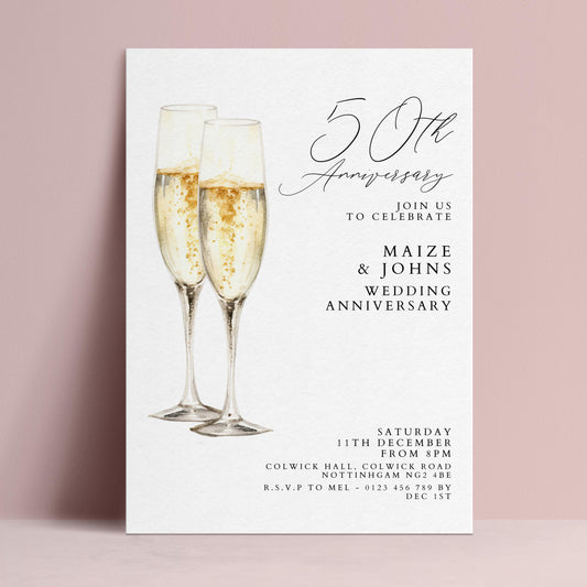 The image is a wedding anniversary invitation featuring two champagne glasses with champagne bubbles, celebrating the 50th anniversary of Maize & Johns' wedding.