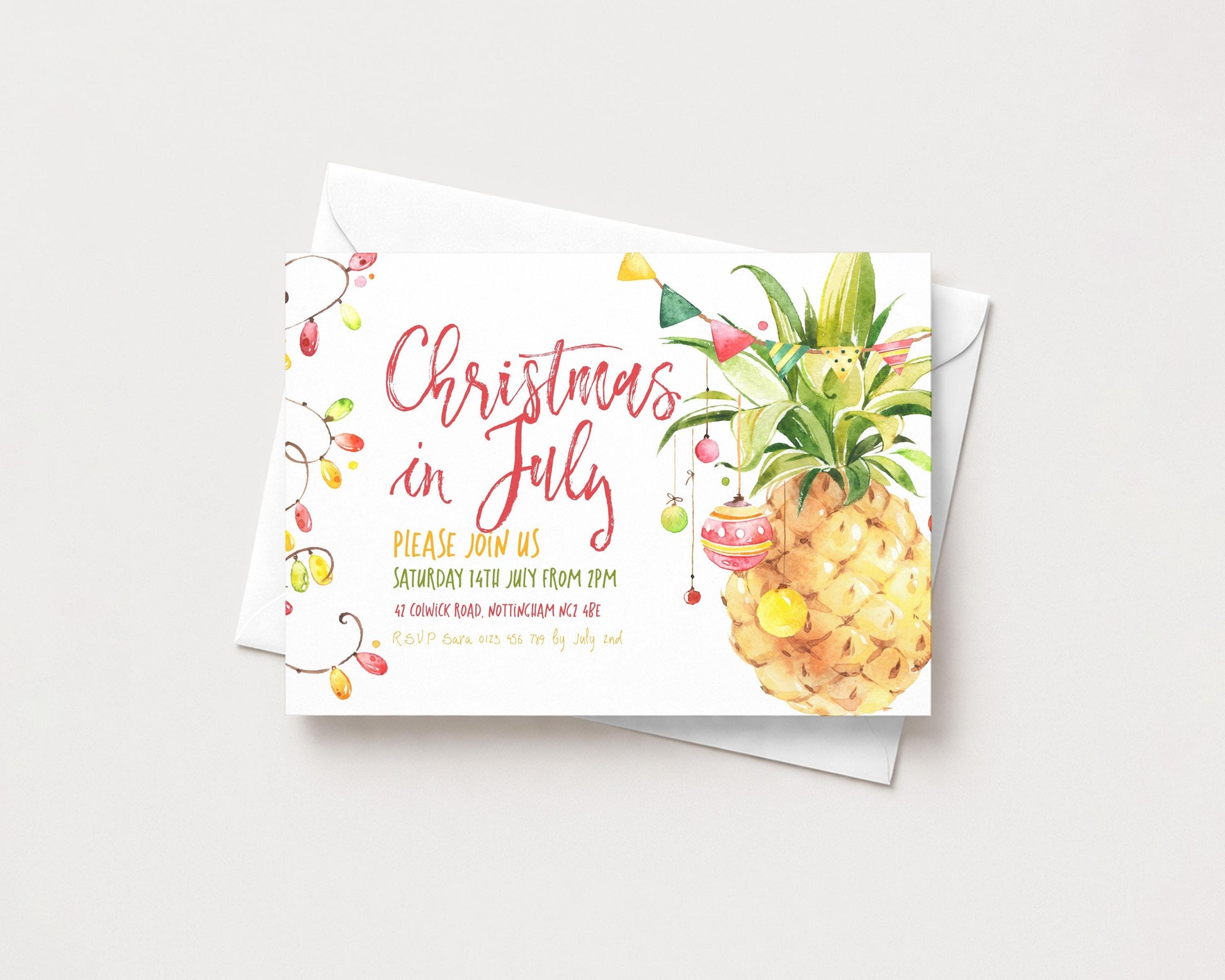 A Christmas in July invitation card featuring a pineapple illustration and colorful holiday decorations.