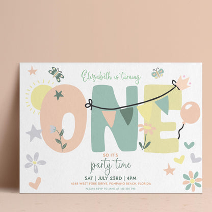 The image is a birthday party invitation for a one-year-old named Elizabeth. The invitation features a playful design with the word "ONE" made up of various shapes and elements, such as stars, hearts, and flowers. The text on the invitation reads "Elizabeth is turning one" and provides details about the party time, date, and location.