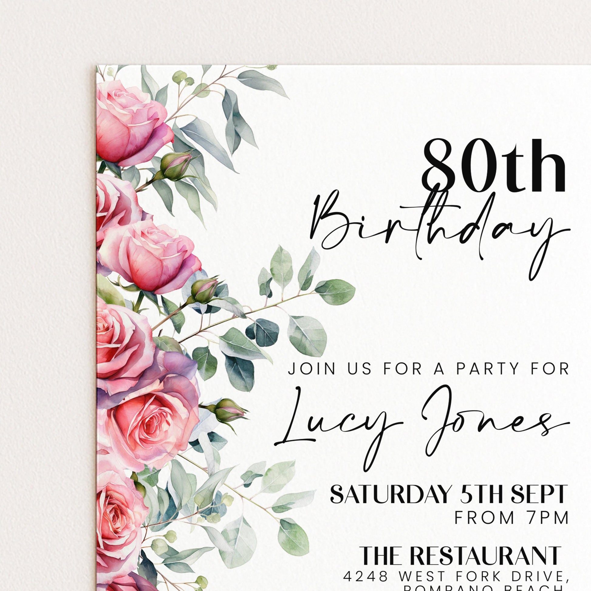 The image is a birthday invitation for a party for Lucy Jones, with a floral design featuring pink roses and greenery.