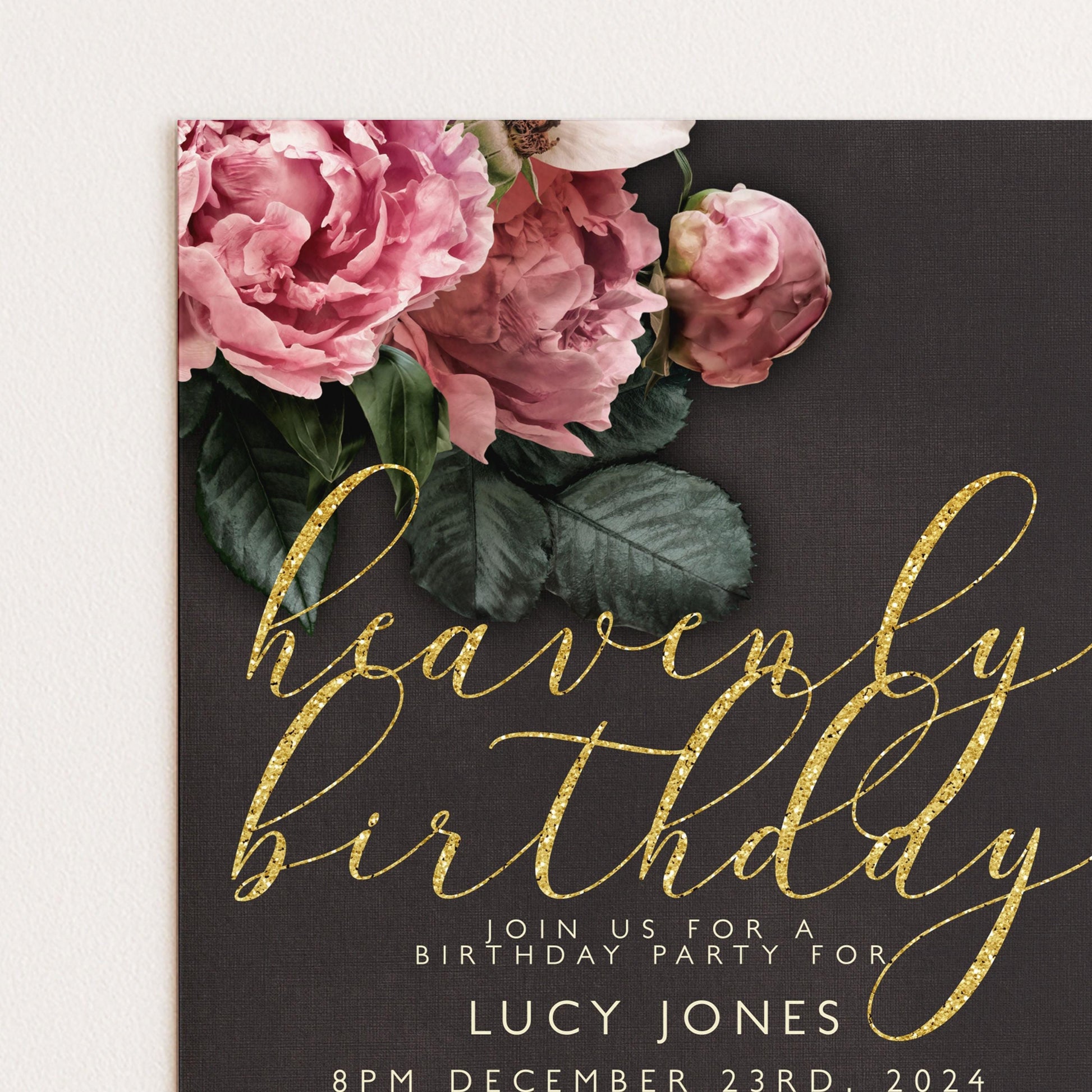 The image is a birthday party invitation featuring a floral design with pink and white flowers against a dark background.