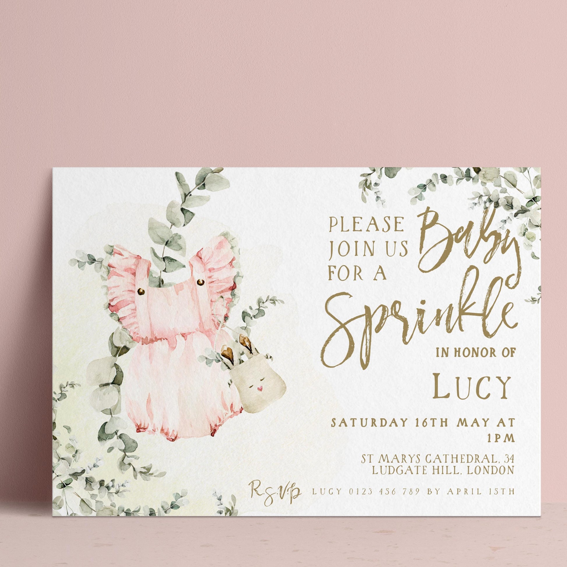 The image is a baby shower invitation featuring a pink fairy and a baby, with a floral design and text inviting guests to join for a sprinkle in honor of Lucy.