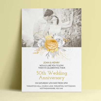 The image is a wedding anniversary invitation featuring a couple embracing and a large yellow rose.