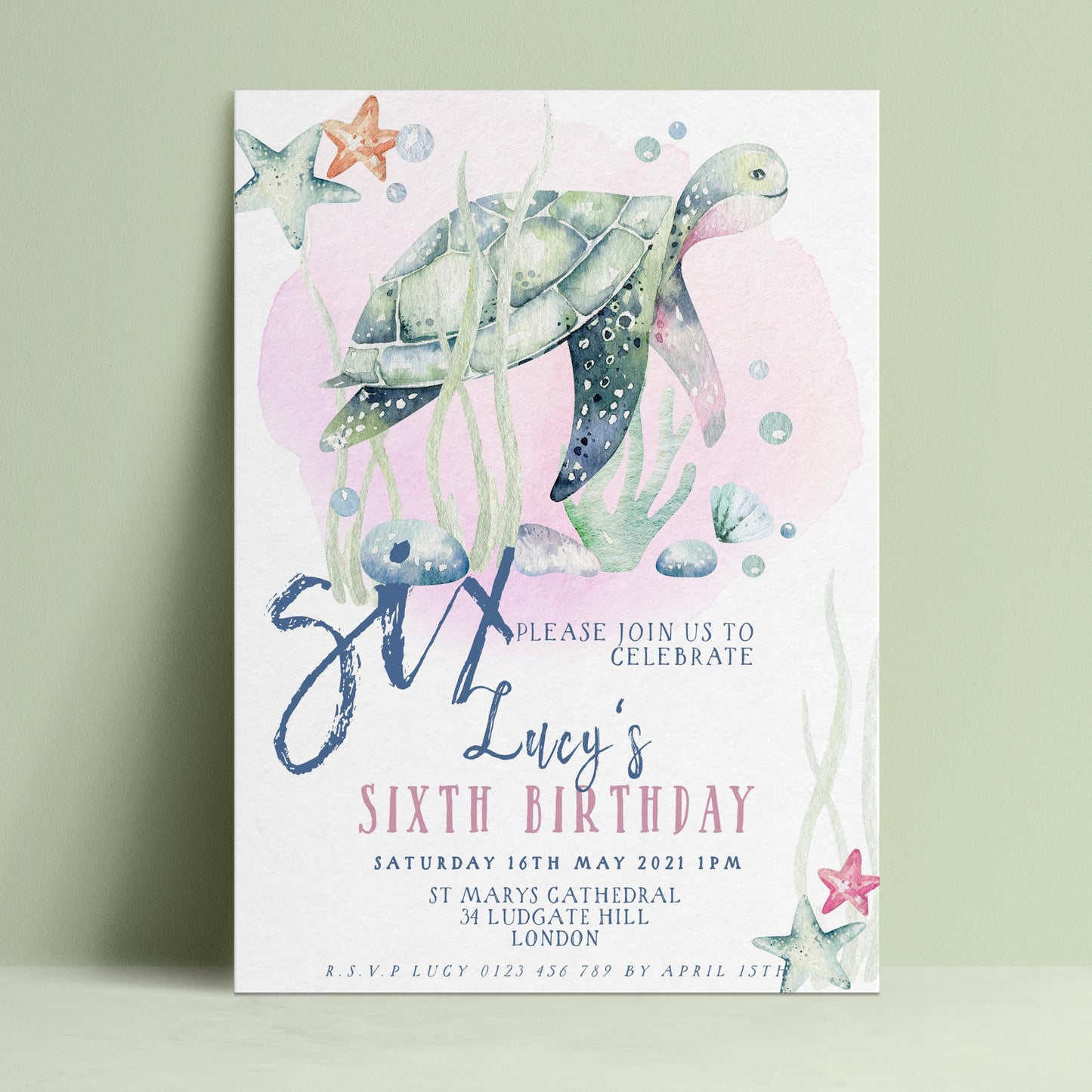 The image is a birthday invitation for a six-year-old named Lucy, featuring a watercolor illustration of a sea turtle swimming among starfish and bubbles.