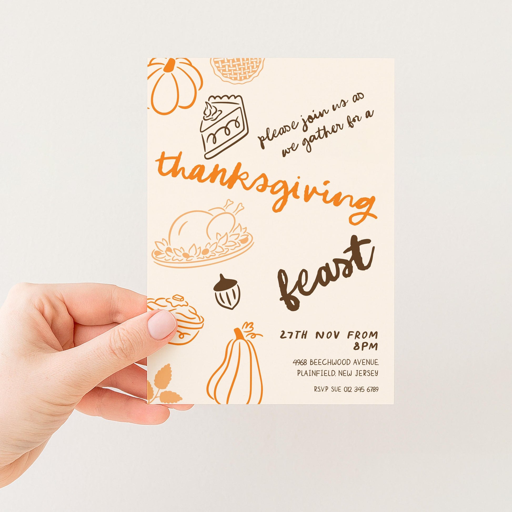 The image is a hand holding a Thanksgiving feast invitation card.