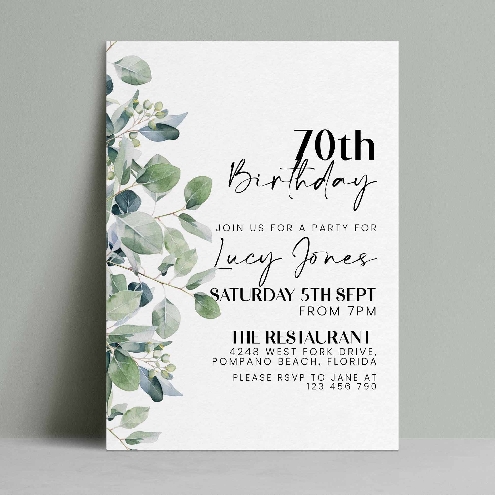 The image is a birthday invitation for a 70th celebration for Lucy Jones. It features a white background with a green leaf design and text inviting guests to a party at The Restaurant in Pompano Beach, Florida on Saturday, September 5th from 7 PM.