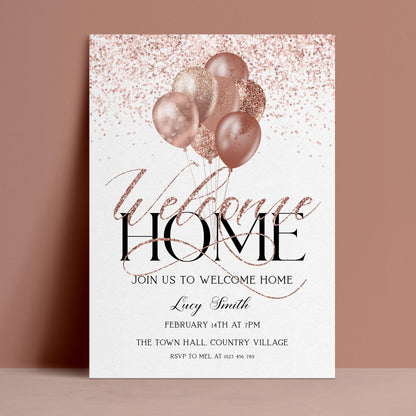 The image is a welcome home invitation featuring pink and gold balloons, with the text "Welcome Home" prominently displayed.