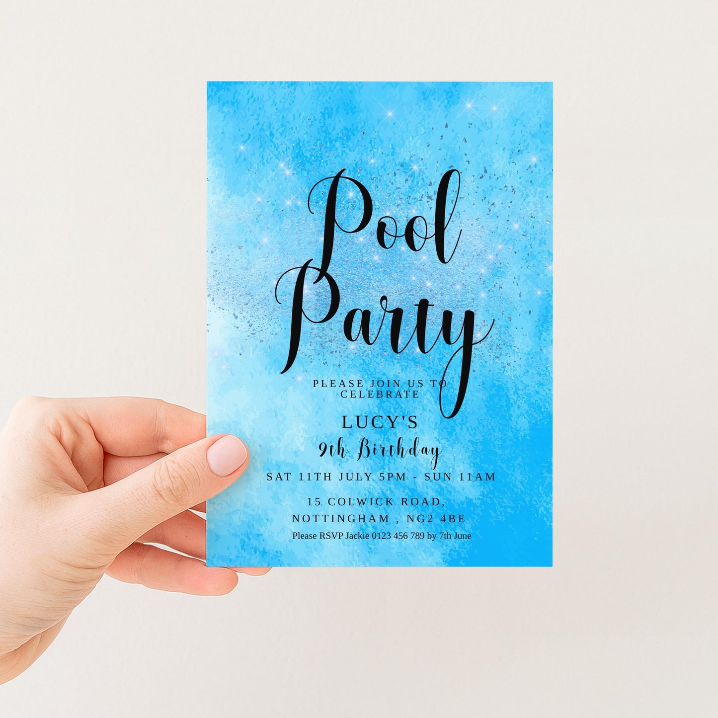 A hand holding a blue invitation card with text and details about a pool party.