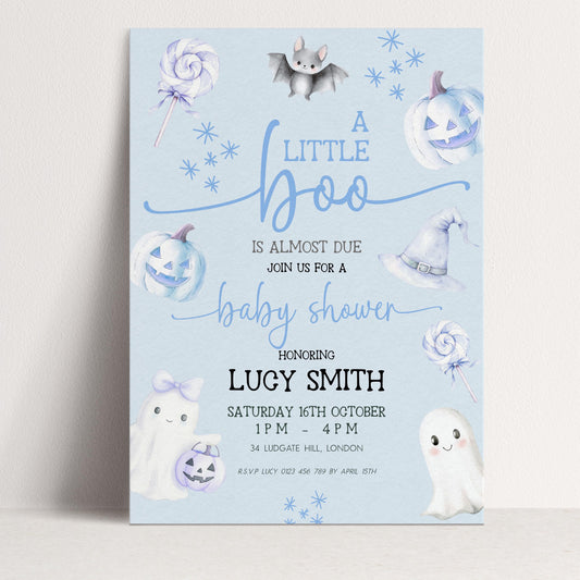 A baby shower invitation featuring a light blue background with illustrations of bats, pumpkins, and ghostly figures.