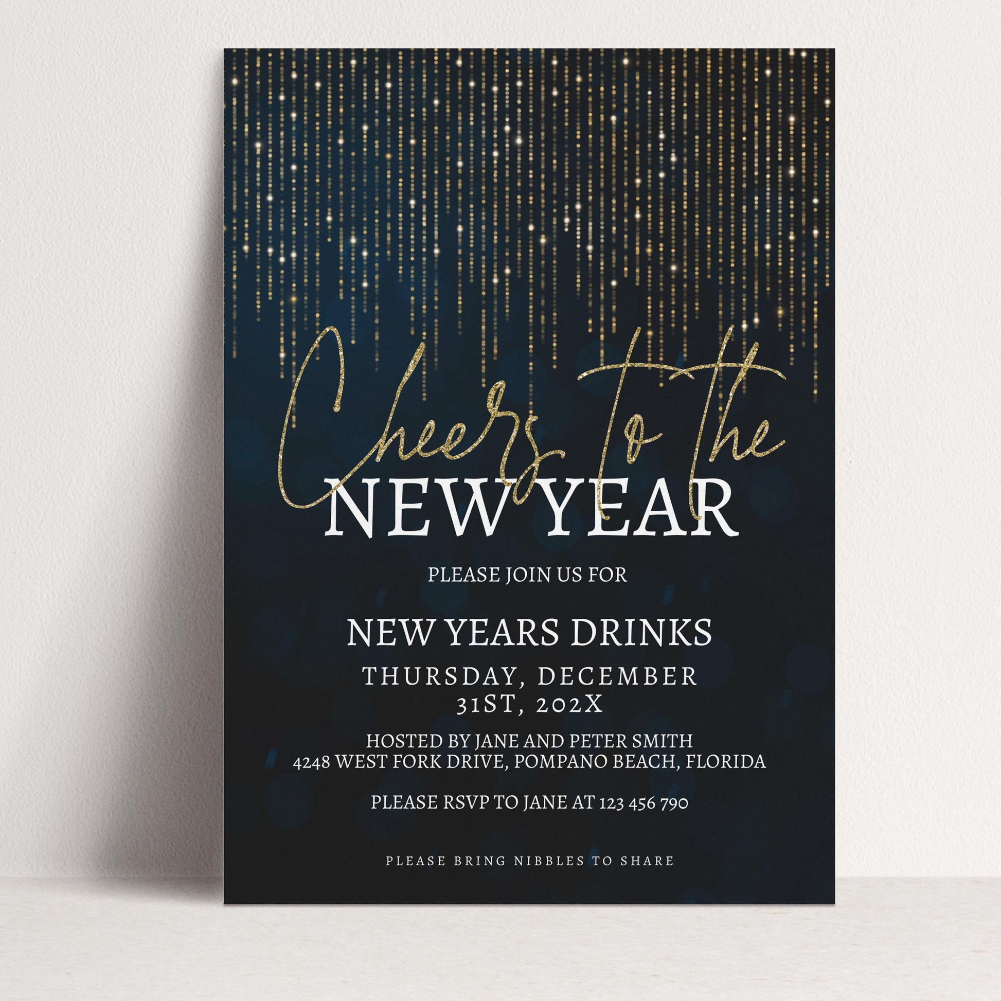 The image is a New Year's party invitation with a dark blue background and gold glittering lines. The text invites guests to a New Year's drinks event on Thursday, December 31st, at 12:00 PM, hosted by Jane and Peter Smith at 4248 West Fork Drive, Pompano Beach, Florida. The invitation also requests guests to bring nibbles to share.