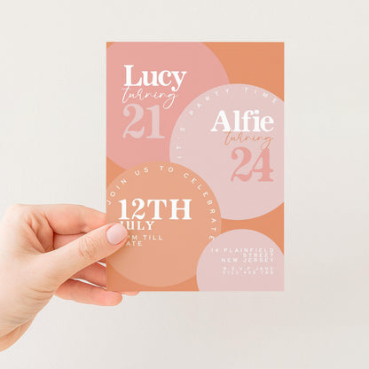 a hand holding a birthday invitation card with text and graphics.