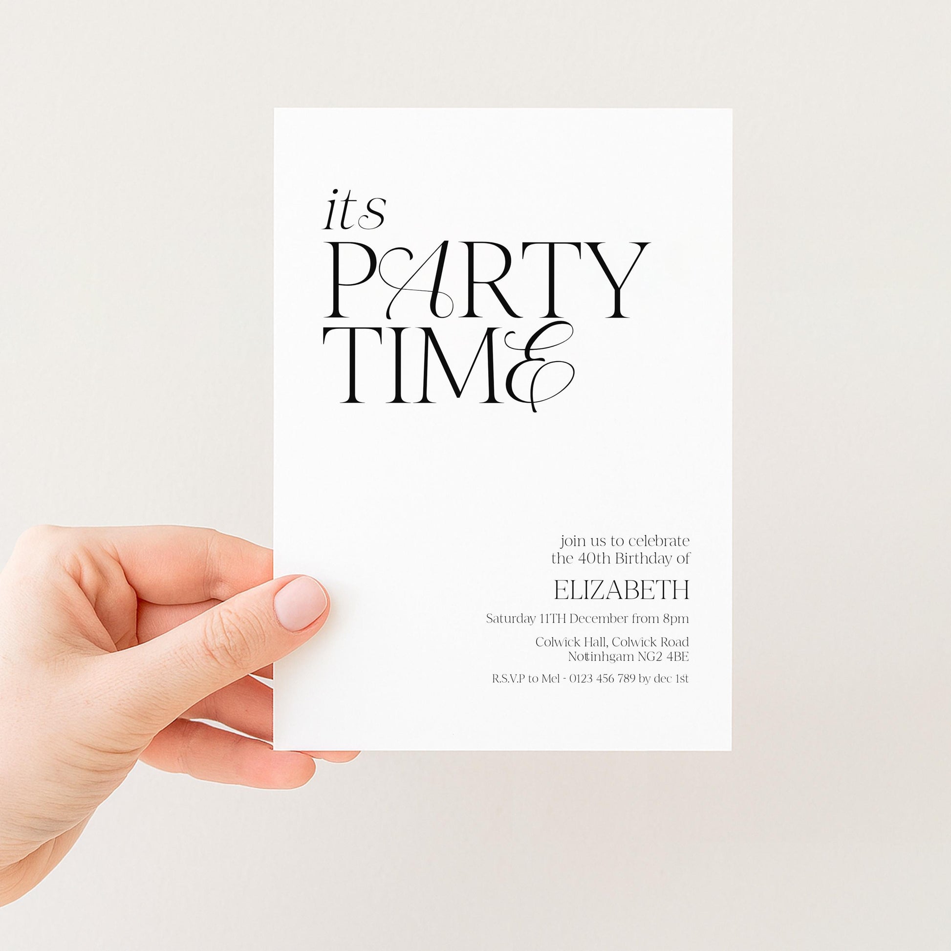 a person's hand holding a white invitation card with black text.