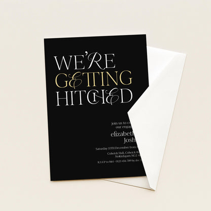 The image is a black wedding invitation card with white text and a gold decorative element.