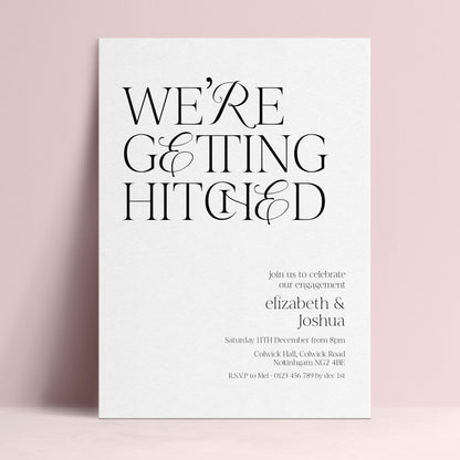The image is a wedding invitation card with the text "WE'RE GETTING HITCHED" prominently displayed.