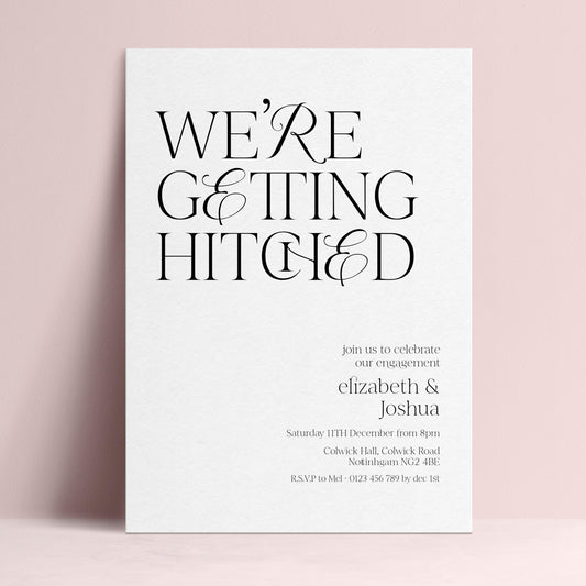 The image is a wedding invitation card with the text "WE'RE GETTING HITCHED" prominently displayed.